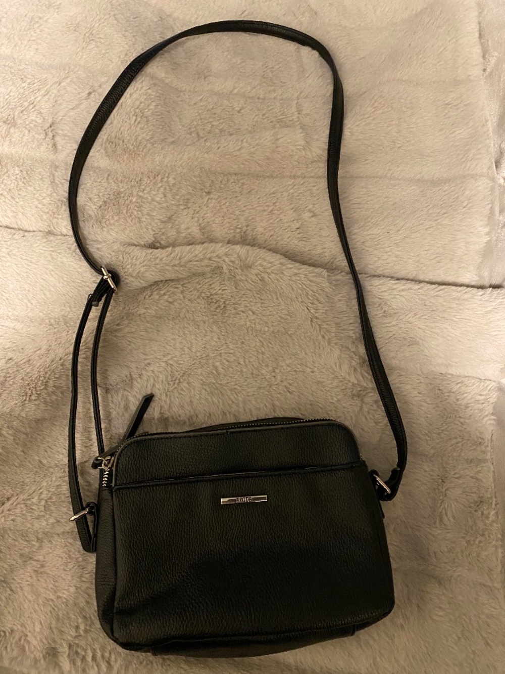 Roots cross body bag